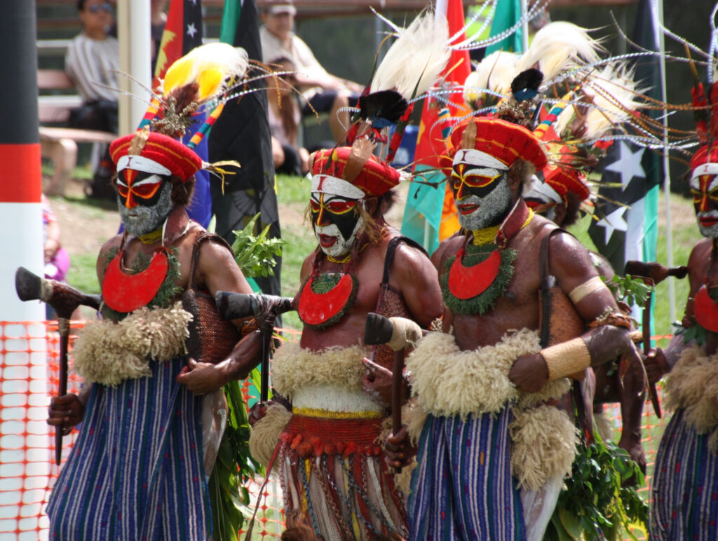 Traditional Papua New Guinea dancers in colourful attire.